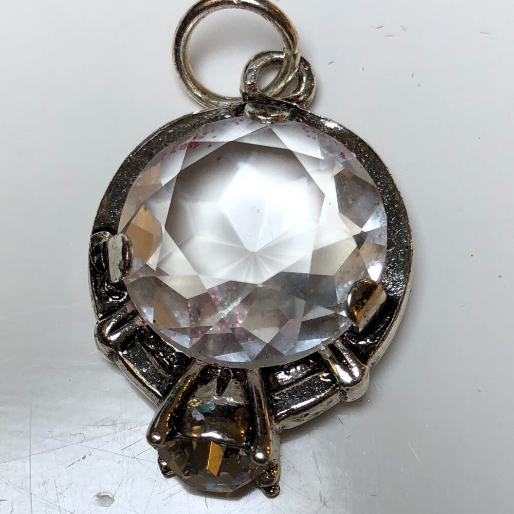 Clear faceted  ring pendant in silvertone with crystal